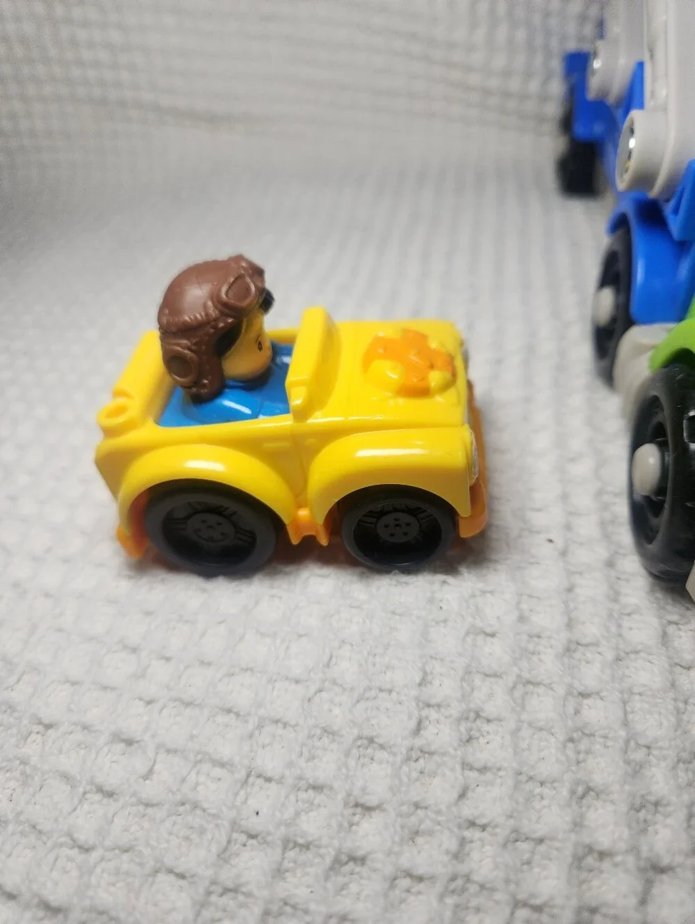 Fisher-Price Blue and Green Car Carrier with Yellow Toy Car Wheelie